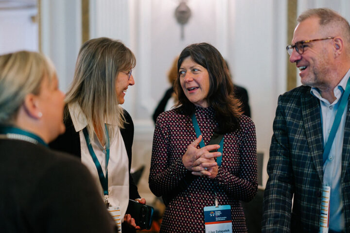 Attendees sharing a moment of conversation together