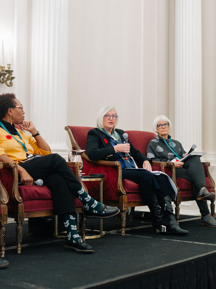Panelists on stage during the panel on respite