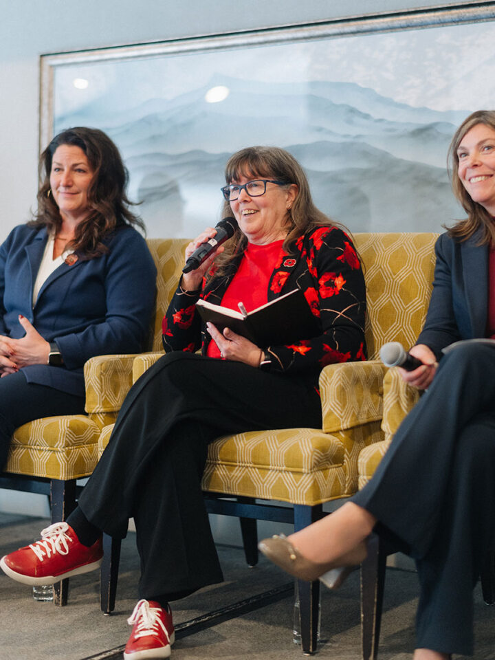 Tamara Kleinschmidt smiles while answering a question at the military and caregiving panel