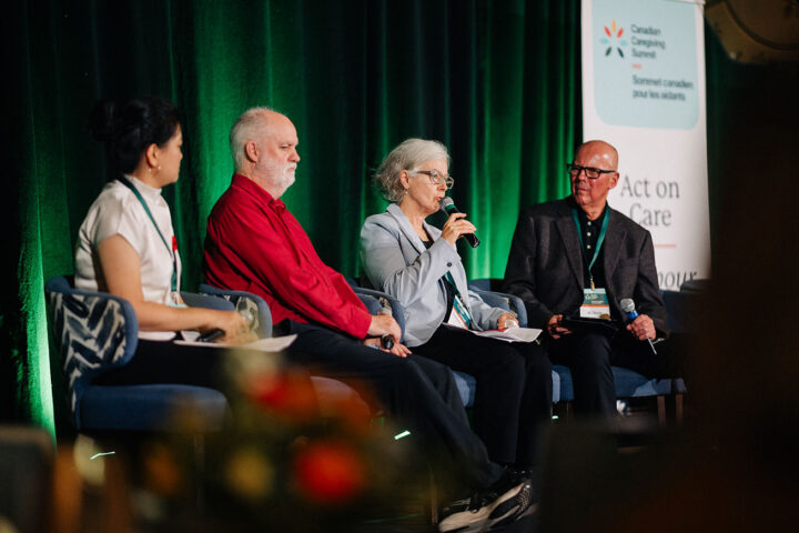 Speakers from the care in the media panel on stage, with Elizabeth Payne speaking