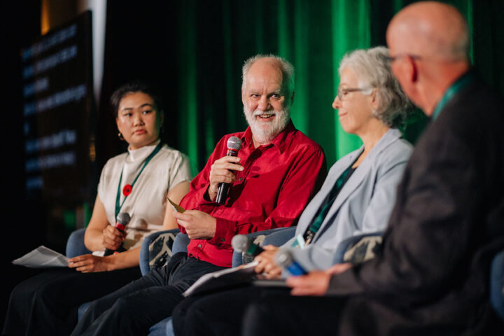 Speakers from the care in the media panel on stage, with Andre Picard in focus