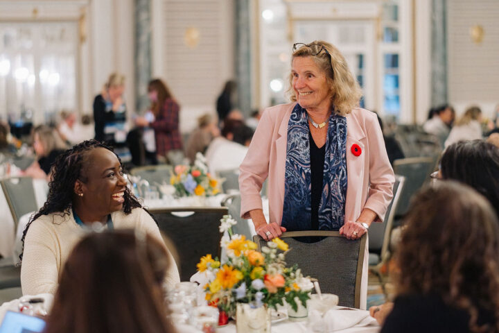 Former Ontario Premier Kathleen Wynne speaks with attendees during the workshop