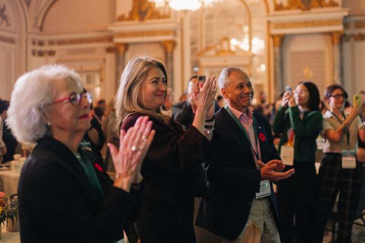 Audience members applauding