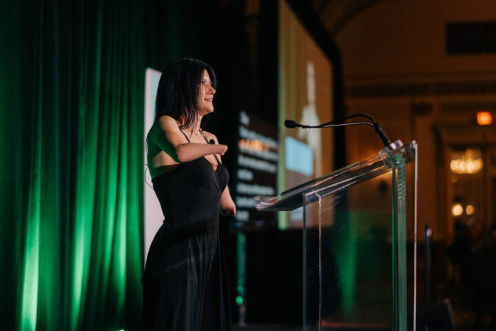 Comedian Courtney Gilmour on stage at the gala