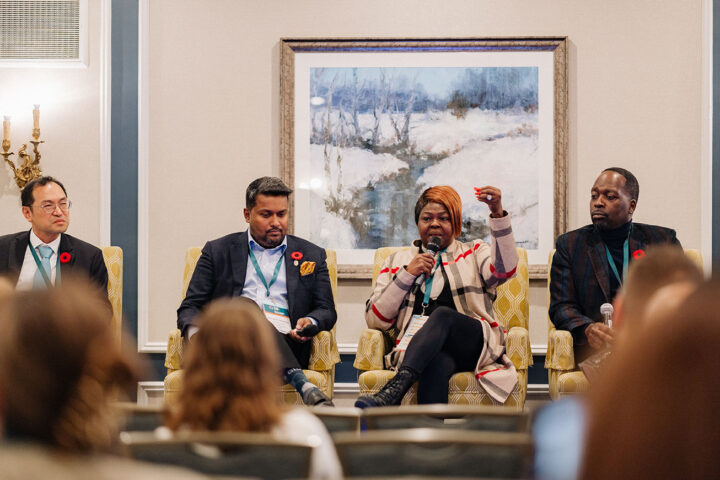 Panelists from the care delivery session speaking in front of audience members.