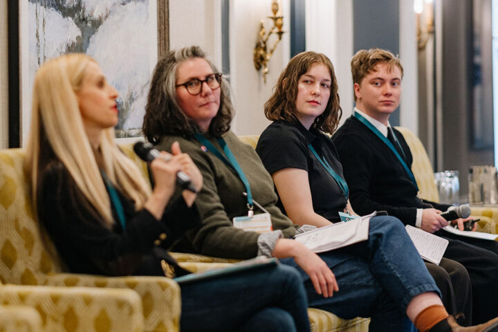 Speakers from the Young Caregivers panel seated on stage