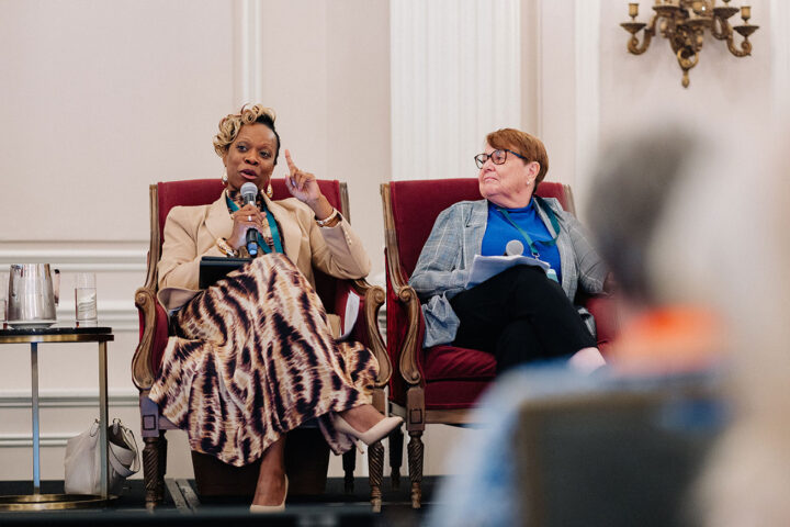 Ngozi Iroanyah speaks at the panel on collaborative care, with fellow panelist Sharon Anderson seated next to her