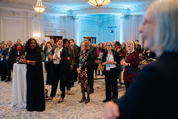Attendees at the parliamentary reception clapping after Minister Hadju's speech