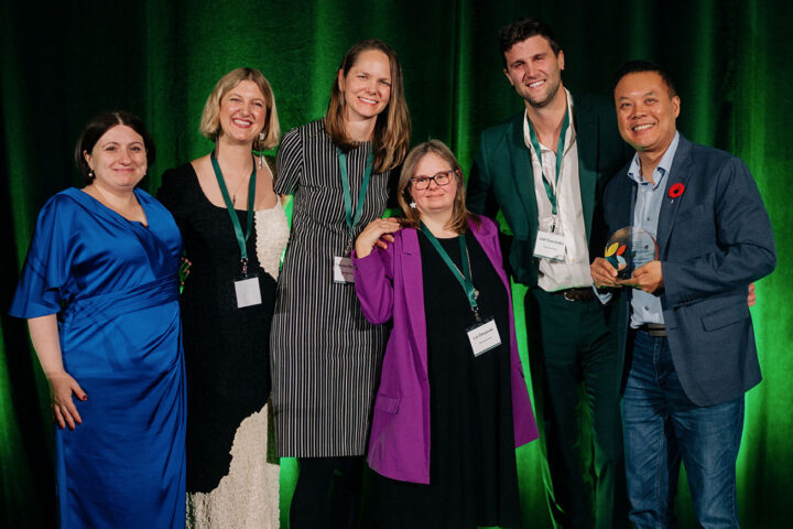 Award recipient Ron Beleno with CCCE's Liv Mendelsohn and the children of the late Vickie Cammack