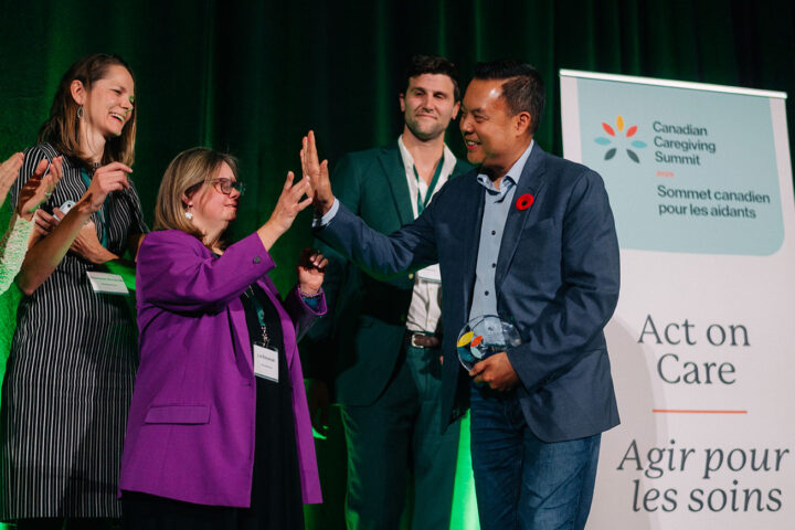 Ron Beleno and Liz Etmanski exchange a high five as Vickie Cammack's other children look on