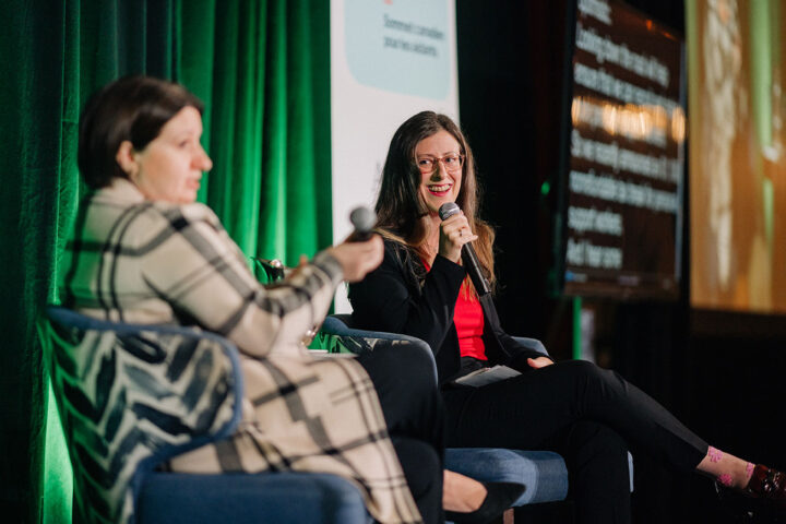 Stephanie McLean, Secretary of State for Seniors, looks over at CCCE's Liv Mendelsohn while smiling